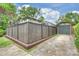 This home features a long driveway leading to a detached garage and a fenced in backyard at 2229 Kenmore Ave, Charlotte, NC 28204