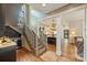 Open concept kitchen with island bar, wine cooler, and staircase at 2229 Kenmore Ave, Charlotte, NC 28204