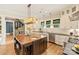 Spacious kitchen with an island bar, modern lighting, and stainless steel appliances at 2229 Kenmore Ave, Charlotte, NC 28204