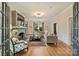 Bright living room featuring hardwood floors, a fireplace, and ample natural light, creating a cozy and inviting atmosphere at 2229 Kenmore Ave, Charlotte, NC 28204