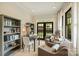 Cozy sitting room with built-in bookshelves and an abundance of natural light from the French doors at 2229 Kenmore Ave, Charlotte, NC 28204