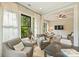 Bright sitting room featuring two chairs, white curtains, and view to an adjacent Gathering room at 2229 Kenmore Ave, Charlotte, NC 28204