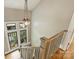 Bright staircase featuring natural light, hardwood floors and gray railing at 2229 Kenmore Ave, Charlotte, NC 28204