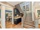 Hallway with staircase, wine rack, wet bar, and view into the dining room at 2229 Kenmore Ave, Charlotte, NC 28204