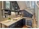 Elegant wet bar with granite counters, wine rack, and beverage refrigerator at 2229 Kenmore Ave, Charlotte, NC 28204