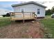 A newly constructed wooden deck on the back of the house offers a nice outdoor space at 234 Olin Loop, Olin, NC 28660