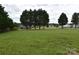 A lush backyard featuring a wide open green space, perfect for outdoor activities at 234 Olin Loop, Olin, NC 28660