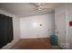 Bedroom featuring carpeted floors, a ceiling fan, and large white walls at 234 Olin Loop, Olin, NC 28660