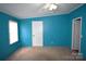 Bright bedroom with a ceiling fan and blue walls, offering a serene space at 234 Olin Loop, Olin, NC 28660