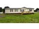Charming single-story home featuring a quaint front porch and well-maintained lawn at 234 Olin Loop, Olin, NC 28660