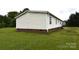 Exterior view of the home showing vinyl siding and brick foundation at 234 Olin Loop, Olin, NC 28660