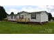 Well-kept home showcasing its front exterior with neat landscaping and cozy porch at 234 Olin Loop, Olin, NC 28660