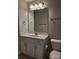 Neutral bathroom featuring a white vanity with marble countertops, toilet, and large mirror at 2355 Villa Oaks Ct, Gastonia, NC 28054