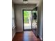 Inviting entryway featuring hardwood floors and a charming wreath on the front door, letting in natural light at 2355 Villa Oaks Ct, Gastonia, NC 28054