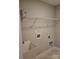 Utility sink in a simple laundry room with open shelving and a neutral color scheme at 2355 Villa Oaks Ct, Gastonia, NC 28054
