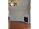 Spacious living room with hardwood floors, fireplace, and ample natural light, ideal for relaxation and entertainment at 2355 Villa Oaks Ct, Gastonia, NC 28054