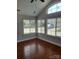Bright living room showcasing hardwood floors and large windows offering plenty of natural light at 2355 Villa Oaks Ct, Gastonia, NC 28054