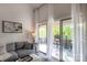 Relaxing seating on the covered balcony providing an outdoor space that overlooks the yard and trees at 2504 Stradbrook Dr # B, Charlotte, NC 28210