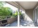 Relaxing balcony with comfortable seating overlooks lush landscaping and peaceful community setting at 2504 Stradbrook Dr # B, Charlotte, NC 28210