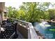 Balcony with outdoor seating overlooking a pond and fountain, offering a serene setting at 2504 Stradbrook Dr # B, Charlotte, NC 28210