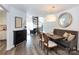 Cozy dining area with modern furnishings, a spiral staircase, and a view into the living room at 2504 Stradbrook Dr # B, Charlotte, NC 28210