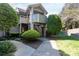 Exterior view of the home with a walkway, stairs, and mature landscaping at 2504 Stradbrook Dr # B, Charlotte, NC 28210