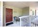 Inviting front door with a covered porch and seating area at 2504 Stradbrook Dr # B, Charlotte, NC 28210