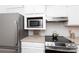Updated kitchen with stainless steel appliances, white cabinets, and modern features for cooking at 2504 Stradbrook Dr # B, Charlotte, NC 28210