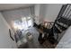Aerial view of a living room showing a spiral staircase, fireplace and sliding doors to a balcony at 2504 Stradbrook Dr # B, Charlotte, NC 28210