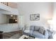 Bright living room with modern decor, wood floors, and an open view of the kitchen at 2504 Stradbrook Dr # B, Charlotte, NC 28210