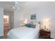 Bright main bedroom with a ceiling fan and a view of the en-suite bathroom at 2504 Stradbrook Dr # B, Charlotte, NC 28210