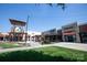 View of a retail area with manicured grass and pedestrian walkways at 2504 Stradbrook Dr # B, Charlotte, NC 28210