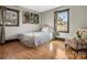 Quaint bedroom with hardwood floors and natural lighting at 2701 N Sharon Amity Rd, Charlotte, NC 28205