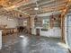 The open-concept kitchen features open shelves and a stainless steel sink at 2701 N Sharon Amity Rd, Charlotte, NC 28205