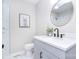 Modern bathroom featuring a round mirror, sleek vanity, and stylish fixtures at 315 N Kimmons St, Landis, NC 28088