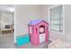 Charming bedroom featuring a colorful playhouse and toy chest for  at 315 N Kimmons St, Landis, NC 28088