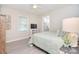Bright bedroom with ensuite bathroom and decorative side table at 315 N Kimmons St, Landis, NC 28088