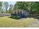 A charming single-story home with a covered front porch, complemented by a neatly maintained lawn at 315 N Kimmons St, Landis, NC 28088