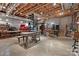 Spacious basement featuring exposed ceiling, spiral staircase, and versatile workshop or recreational area at 32060A Flint Ridge Rd, Albemarle, NC 28001