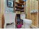 Functional bathroom with a sink, toilet, wooden shelves and wooden walls at 32060A Flint Ridge Rd, Albemarle, NC 28001