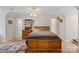 Large bedroom featuring wood flooring, a ceiling fan, wood furniture, and natural light from a window at 32060A Flint Ridge Rd, Albemarle, NC 28001