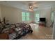 Bright bedroom featuring hardwood floors and a cozy bed with a unique quilt at 32060A Flint Ridge Rd, Albemarle, NC 28001