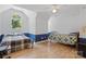 Bedroom features vaulted ceiling, chair railing, and hardwood floors at 32060A Flint Ridge Rd, Albemarle, NC 28001