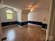 Bedroom features vaulted ceiling, chair railing, and hardwood floors at 32060A Flint Ridge Rd, Albemarle, NC 28001