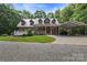 Charming brick home with a metal roof, covered porch, and convenient carport on a well-maintained lot at 32060A Flint Ridge Rd, Albemarle, NC 28001