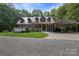 Charming brick home with a metal roof, covered porch, and convenient carport on a well-maintained lot at 32060A Flint Ridge Rd, Albemarle, NC 28001