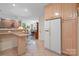Bright kitchen featuring wood cabinets, tiled flooring, stainless-steel appliances, and an open-concept design at 32060A Flint Ridge Rd, Albemarle, NC 28001