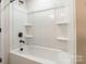A clean, bright bathroom features a shower and tub combination with a shower head at 3832 Amalia Pl, Indian Land, SC 29707
