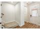 Welcoming foyer with sleek hardwood floors and stairway, featuring an airy, bright atmosphere at 3832 Amalia Pl, Indian Land, SC 29707