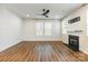 Open-concept living area with hardwood floors and modern fireplace providing an inviting living space at 3832 Amalia Pl, Indian Land, SC 29707